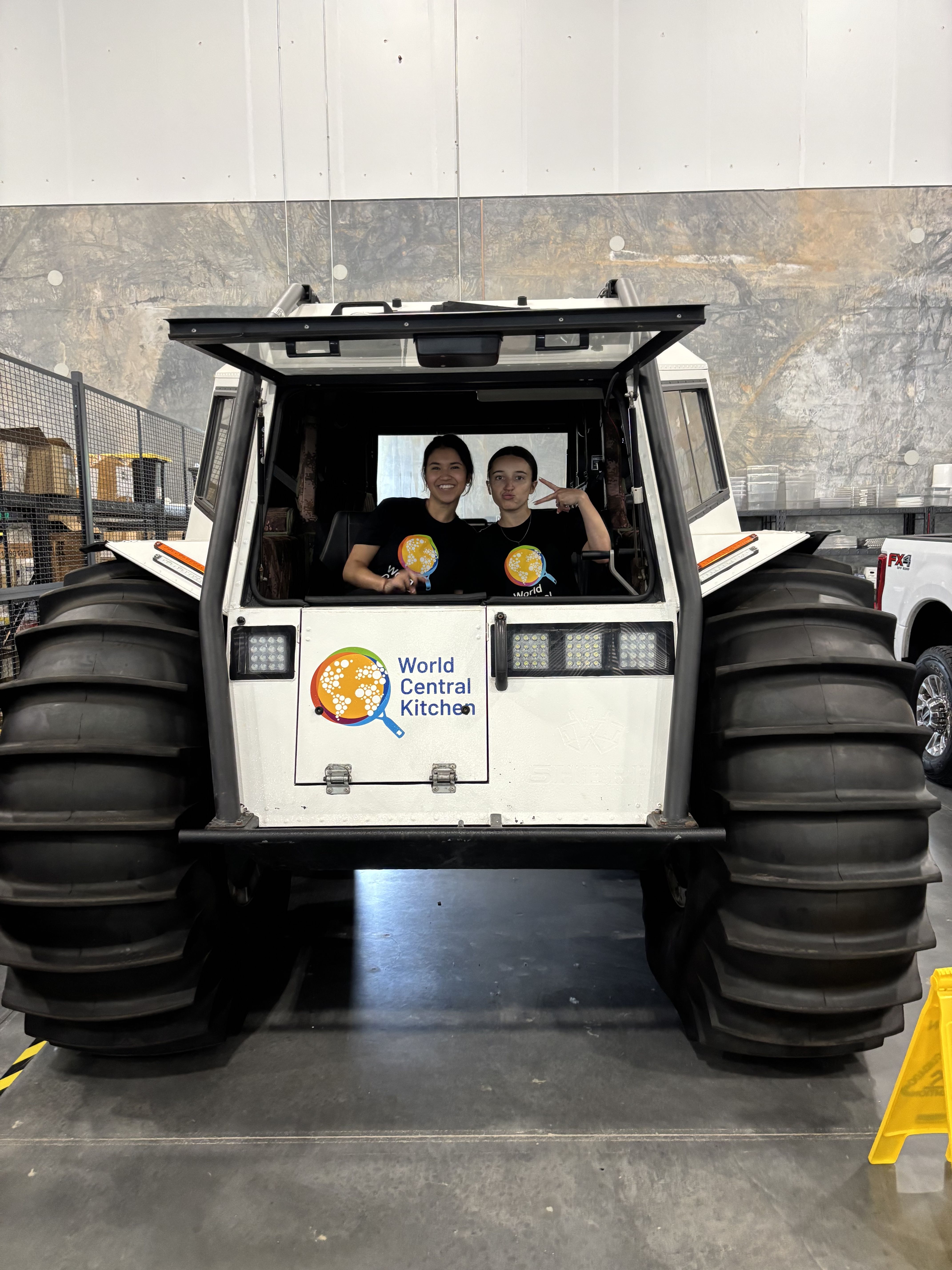 Pravina and Callie, HIP interns, inside a World Central Kitchen vehicle