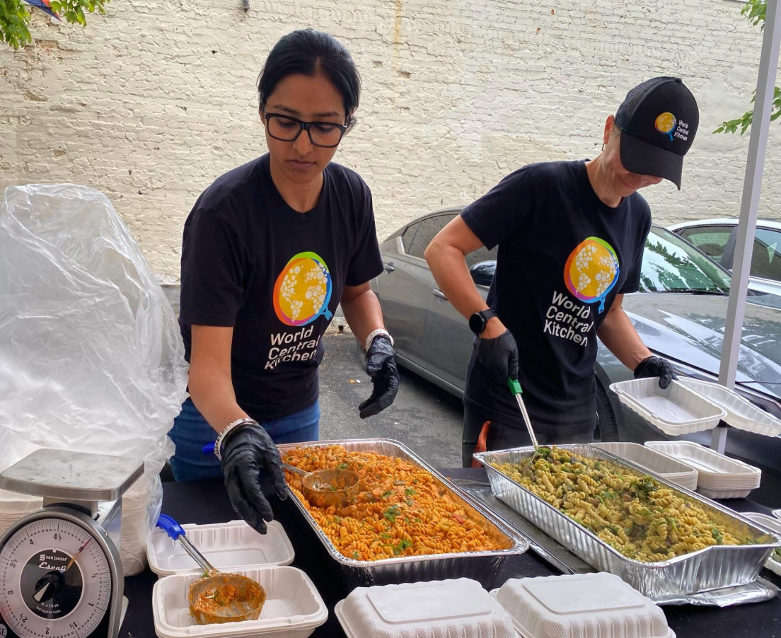 Neha preparing food for World Central Kitchen event.