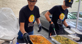 Neha preparing food for World Central Kitchen event.