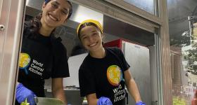 Callie and Anika cutting vegetables during their activation event in SHAW.